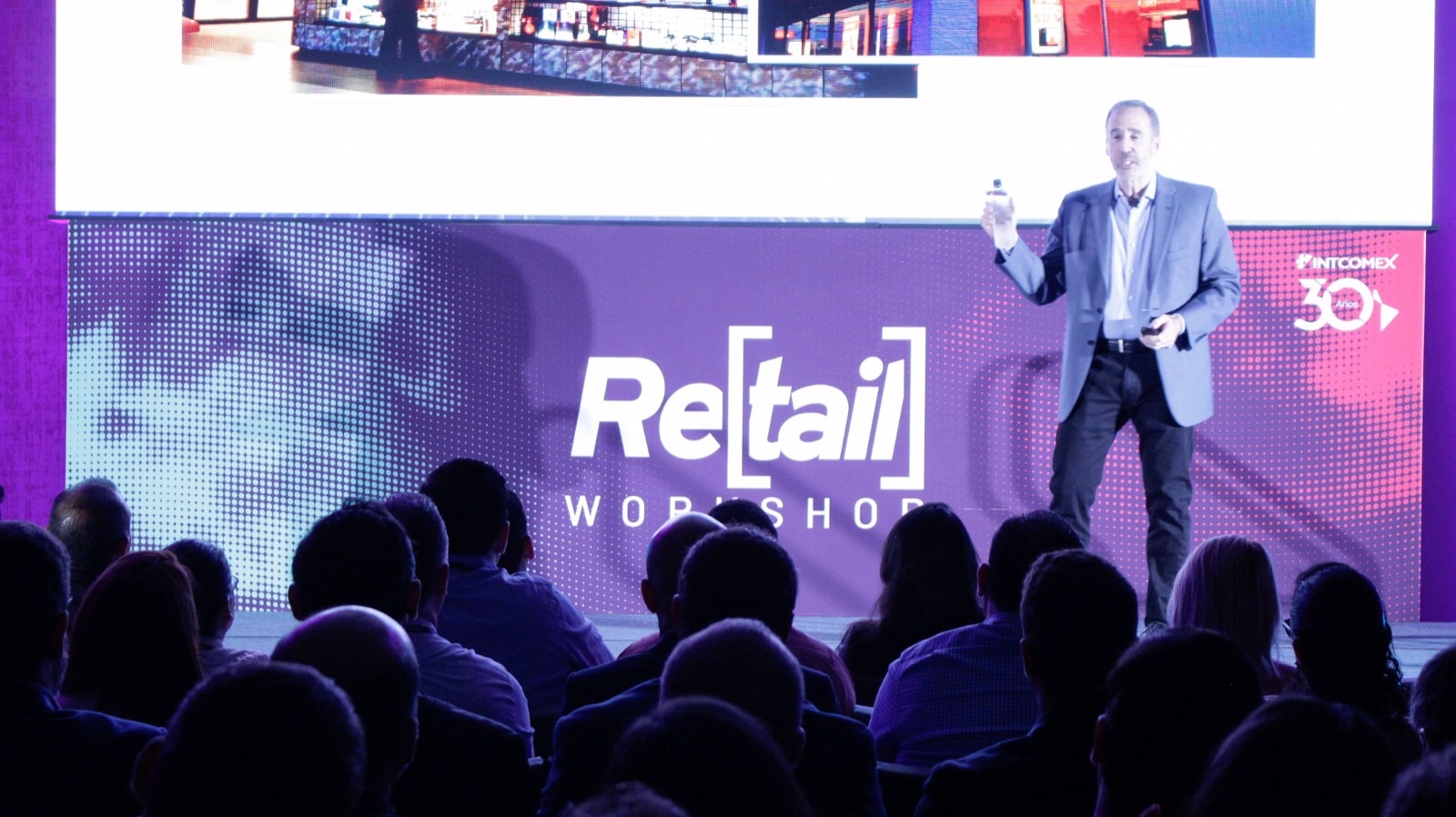 Mike Wittenstein on stage at the Intcomex Retail Workshop, 2019, speaking to a full room